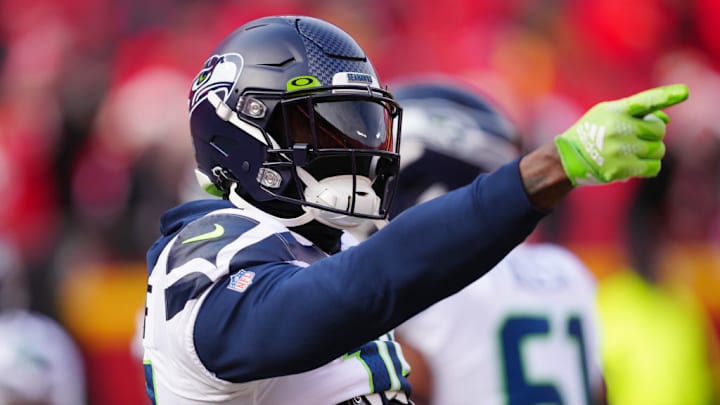 KANSAS CITY, MISSOURI - DECEMBER 24: DK Metcalf #14 of the Seattle Seahawks points during pregame against the Kansas City Chiefs at Arrowhead Stadium on December 24, 2022 in Kansas City, Missouri. 