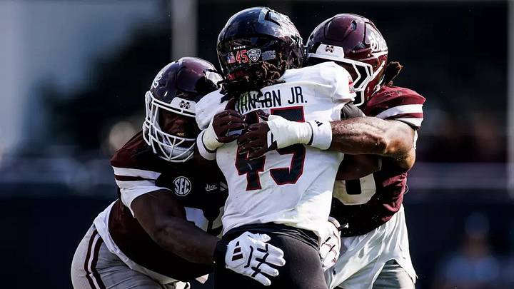 Mississippi State Defensive Lineman Jaray Bledsoe (#92) and Mississippi State Linebacker Nic Mitchell (#40) during the game between the Northern Illinois Huskies and the Mississippi State Bulldogs at Davis Wade Stadium at Scott Field in Starkville, MS. Mississippi State Defensive Lineman Jaray Bledsoe (#92) and Mississippi State Linebacker Nic Mitchell (#40) during the game between the Northern Illinois Huskies and the Mississippi State Bulldogs at Davis Wade Stadium at Scott Field in Starkville, MS.