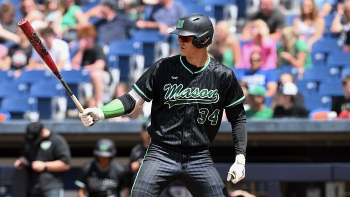 Mason's Jake Hanley prepares for an at-bat against Twinsburg in the OHSAA Division I state championship game on June 9, 2024. Mason's Jake Hanley prepares for an at-bat against Twinsburg in the OHSAA Division I state championship game on June 9, 2024.