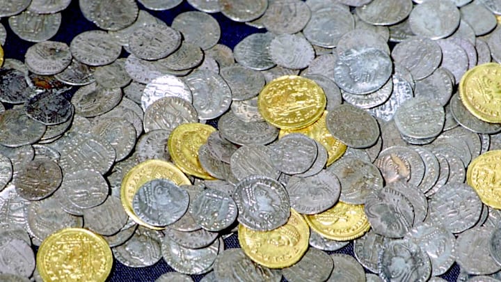 Roman coins from the Hoxne hoard, buried in the 5th century in Hoxne, Suffolk, UK.