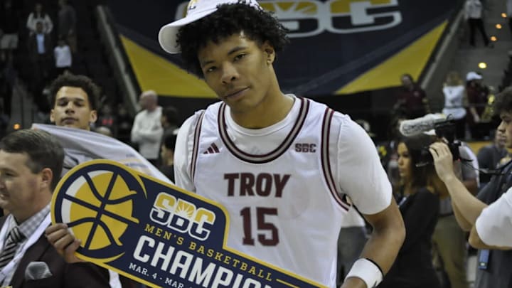 New West Virginia Forward Jackson Fields celebrates SBC Title that he won with Troy this past year.