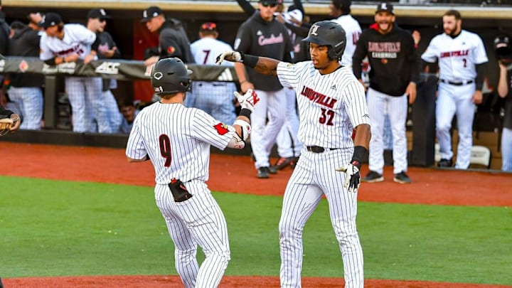Louisville baseball infielder Dylan Hoy (9) and catcher Zion Rose (32)