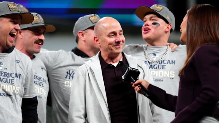 New York Yankees general manager Brian Cashman celebrates the team defeating the Cleveland Guardians in the American League Championship Series.