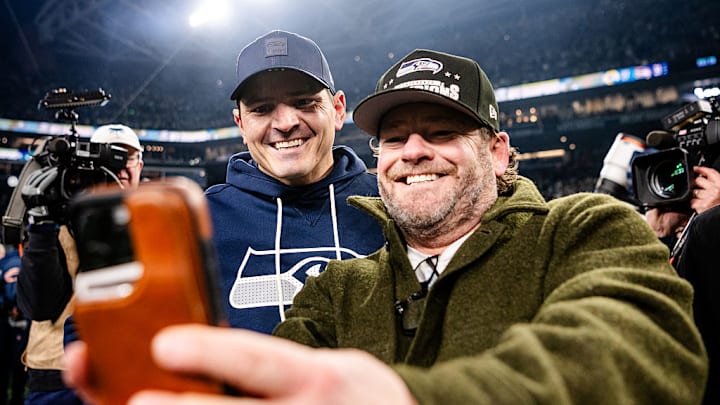 Seattle Seahawks coach Mike Macdonald and GM John Schneider celebrate winning the NFC championship.