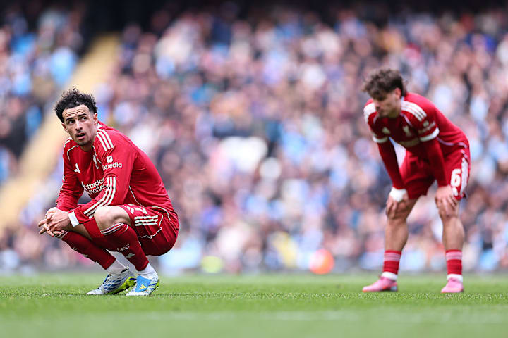 Liverpool players look dejected Liverpool players look dejected