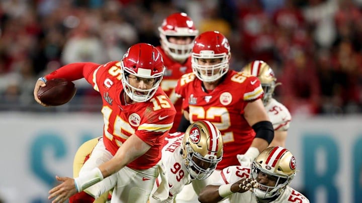 Kansas City Chiefs quarterback Patrick Mahomes breaks off a run after escaping from San Francisco 49ers defensive tackle DeForest Buckner and defensive end Dee Ford during the fourth quarter of Super Bowl LIV at Hard Rock Stadium in Miami Gardens, on Feb. 2, 2020.