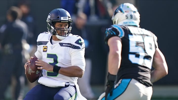 Dec 15, 2019; Charlotte, NC, USA;Seattle Seahawks quarterback Russell Wilson (3) against Carolina Panthers middle linebacker Luke Kuechly (59) during the second quarter at Bank of America Stadium. 
