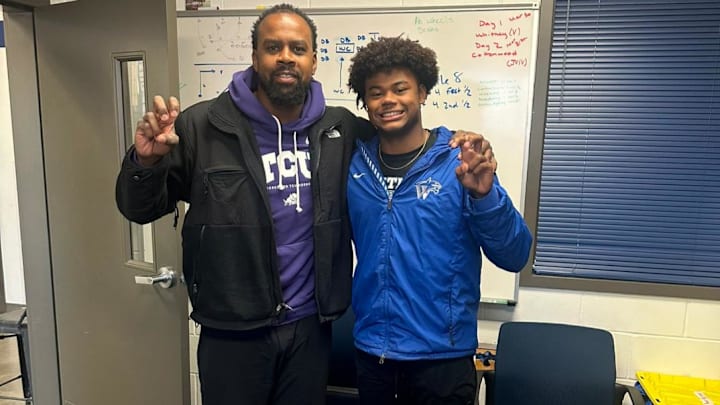 TCU wide receivers coach Malcolm Kelly and Kobe Haynes.