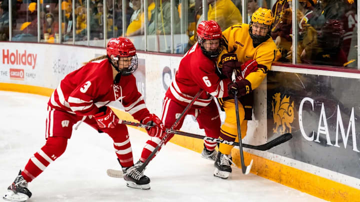 Minnesota forward Josefin Bouveng, right, makes a play on the boards against Wisconsin on Feb. 11, 2023, at Ridder Arena in Minneapolis.
