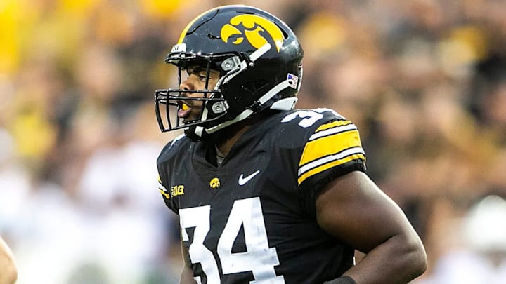Iowa linebacker Jay Higgins (34) holds the football after a special teams play during a NCAA Big Ten Conference football game against Penn State, Saturday, Oct. 9, 2021, at Kinnick Stadium in Iowa City, Iowa. Iowa beat Penn State, 23-20. / Joseph Cress/Iowa City Press-Citizen / USA TODAY NETWORK