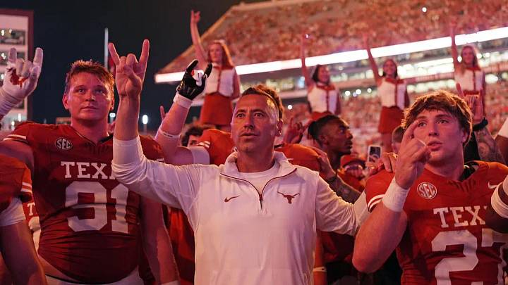 Sep 14, 2024; Austin, Texas, USA; Texas Longhorns head coach Steve Sarkisian stands for the Eyes of Texas with players and fans after a victory over the Texas-San Antonio Roadrunners at Darrell K Royal-Texas Memorial Stadium.