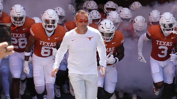 Texas Longhorns Head Coach Steve Sarkisian leads his team on to the field before a game against the Texas State Bobcats at Darrell K Royal-Texas Memorial Stadium. Texas Longhorns Head Coach Steve Sarkisian leads his team on to the field before a game against the Texas State Bobcats at Darrell K Royal-Texas Memorial Stadium.