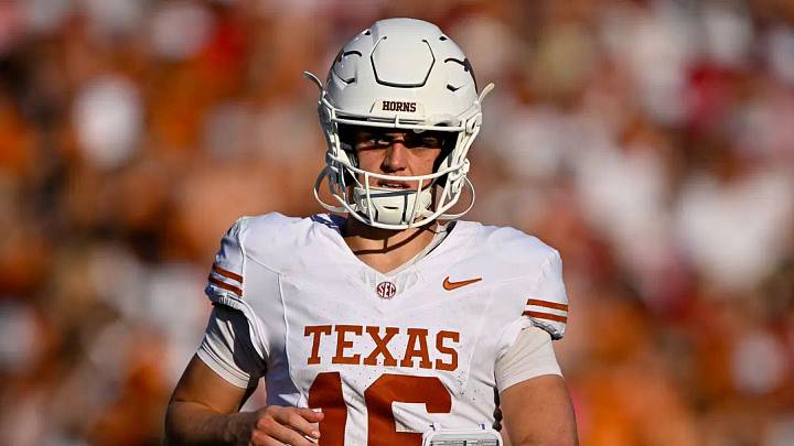 Texas Longhorns quarterback Arch Manning (16) runs back on the field during the game between the Sooners and the Longhorns at Cotton Bowl. Texas Longhorns quarterback Arch Manning (16) runs back on the field during the game between the Sooners and the Longhorns at Cotton Bowl.