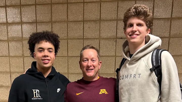 Niko Medved with East Ridge guard Cedric Tomes (left) and Wayzata forward Nolen Anderson (right). Niko Medved with East Ridge guard Cedric Tomes (left) and Wayzata forward Nolen Anderson (right).