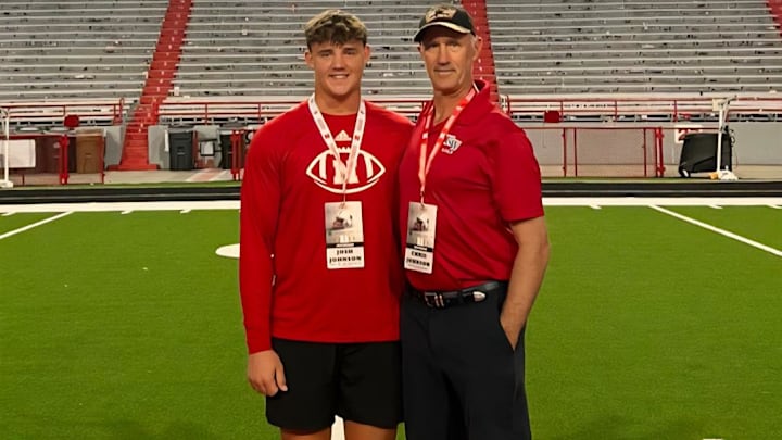 Josh Johnson (left) and his father Chris at Memorial Stadium after the Michigan game. 