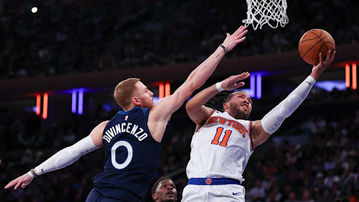 New York Knicks guard Jalen Brunson attempts to shoot over Minnesota Timberwolves guard Donte DiVincenzo. New York Knicks guard Jalen Brunson attempts to shoot over Minnesota Timberwolves guard Donte DiVincenzo.