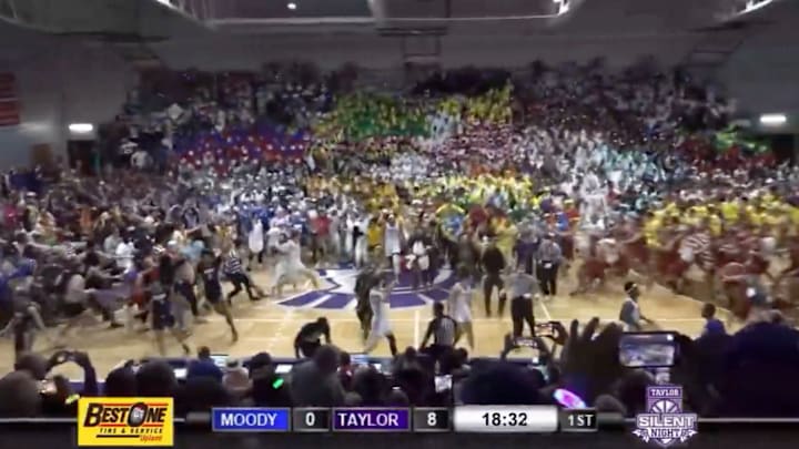 Taylor University students storm the court during the 2024 Silent Night game.