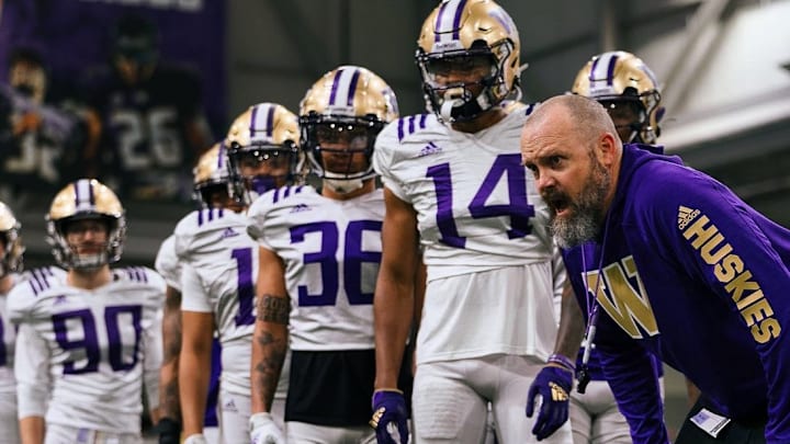 Chuck Morrell runs his UW safeties through a spring football drill. Chuck Morrell runs his UW safeties through a spring football drill.