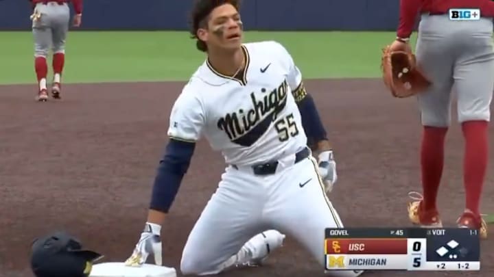 Michigan Wolverines second baseman Mitchell Voit on third base after hitting a triple.