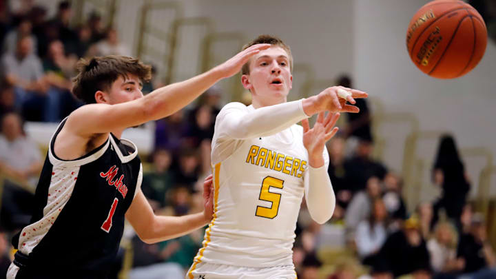 Forest Hills' Dylan Stohon, right, fires a pass away from Mohawk's Bobby Fadden during the second round of the PIAA Class 3A playoffs at Gateway High School in Monroeville. Stohon, a junior who has already scored 1,000 points, help the Rangers make the state quarterfinals for the first time in their history last season.