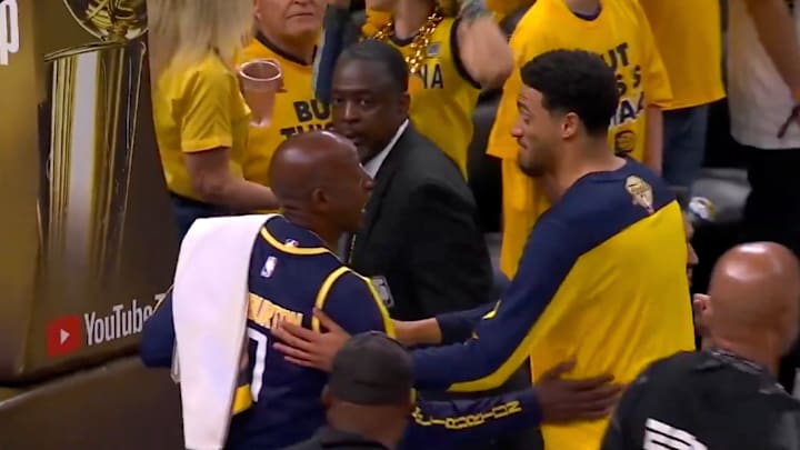 Indiana Pacers guard Tyrese Haliburton talks to his father John on the court at Gainbridge Fieldhouse ahead of Game 3 of the NBA Finals.