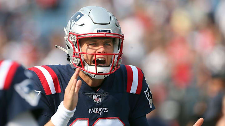 Patriots quarterback Mac Jones gets excited during pregame warmups before his first NFL start.

PATS 1