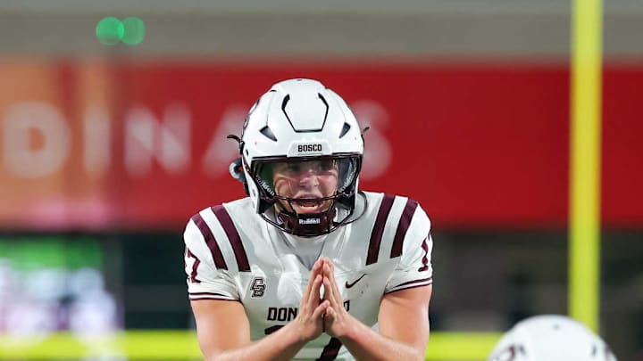 Quarterback Carson Schoen (17) entered the game in the second half and led No. 2 Don Bosco Prep to a pair of touchdown drives, erasing a 10-0 deficit and securing a 14-10 win for the Ironmen over Melissa  (Texas) in the Lone Star State.