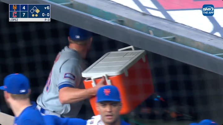New York Mets reliever Jake Diekman throws a cooler in the dugout.
