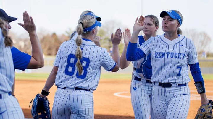 Ally Hutchins (7) celebrates with her teammates after the end of the inning. Ally Hutchins (7) celebrates with her teammates after the end of the inning.