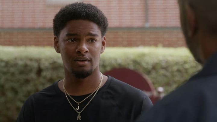 All American: Homecoming -- "We Need A Resolution" -- Image Number: AHC201fg_0r.jpg -- Pictured: Sylvester Powell as JR -- Photo: Troy Harvey/The CW -- (C) 2022 The CW Network, LLC. All Rights Reserved.