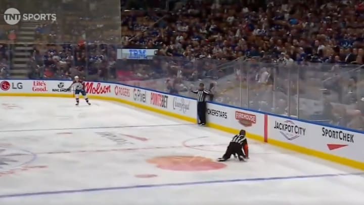 NHL referee Kelly Sutherland sets up a Maple Leafs shorthanded goal after failing to get out of the way of a clearance.