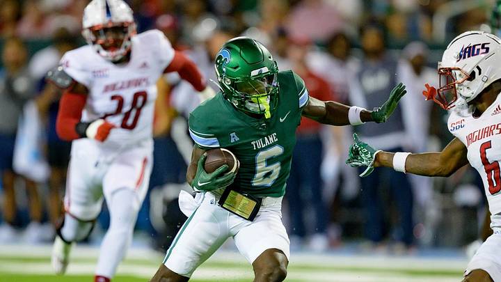 Sept 02, 2023; New Orleans, LA, USA; Former Tulane wide receiver, Lawrence Keys III (6) attempts to stiff arm South Alabama cornerback Ricky Fletcher (6) at Yulman Stadium. Mandatory Credit: Matthew Hinton-AP Sept 02, 2023; New Orleans, LA, USA; Former Tulane wide receiver, Lawrence Keys III (6) attempts to stiff arm South Alabama cornerback Ricky Fletcher (6) at Yulman Stadium. Mandatory Credit: Matthew Hinton-AP