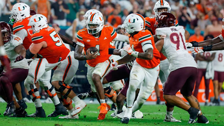 Miami Hurricanes quarterback Cam Ward (1) runs in to score against the Virginia Tech Hokies in the second half at Hard Rock Stadium on Friday, September 27, 2024, in Miami Gardens, Fla. Mandatory Credit: AL DIAZ / MIAMI HERALD 