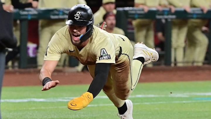 Arizona Diamondbacks Blaze Alexander diving into home plate.
