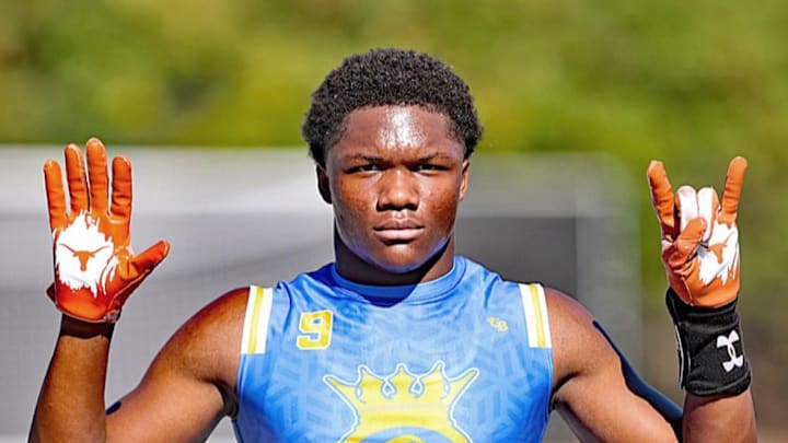 Texas Longhorns commit, and 5-star receiver Easton Royal posing with Texas Longhorns gloves