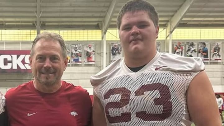 Sheridan Yellowjackets offensive lineman Bradley Sturdivant poses with special teams coordinator Scott Fountain during an Arkansas Razorbacks camp last July. Sturdivant received a scholarship offer from Arkansas Thursday, Jan. 16.