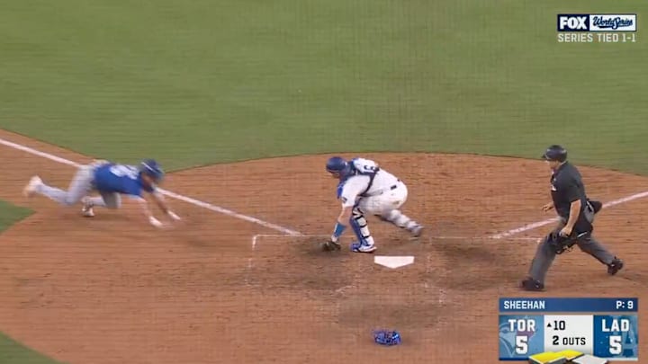 Toronto's Davis Schneider was thrown out at home to end the 10th inning of Game 3. Toronto's Davis Schneider was thrown out at home to end the 10th inning of Game 3.