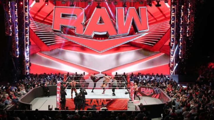 A tag team match in progress during an episode of WWE Monday Night Raw. A tag team match in progress during an episode of WWE Monday Night Raw.