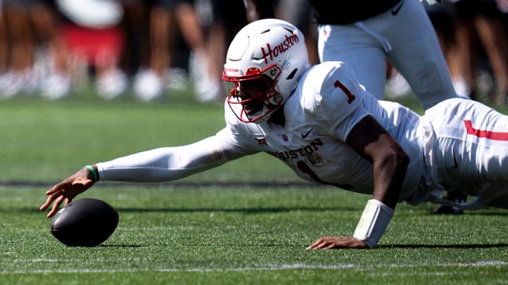 Houston Cougars quarterback Donovan Smith (1) recovers a fumble in the first quarter of the College Football game against the Cincinnati Bearcats at Nippert Stadium in Cincinnati on Saturday, Sept. 21, 2024.