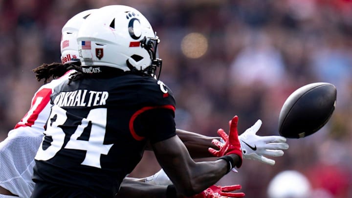 Houston Cougars linebacker Kendre Gant (0) deflects a ball to Cincinnati Bearcats wide receiver Sterling Berkhalter (84) in the third quarter of the College Football game at Nippert Stadium in Cincinnati on Saturday, Sept. 21, 2024.