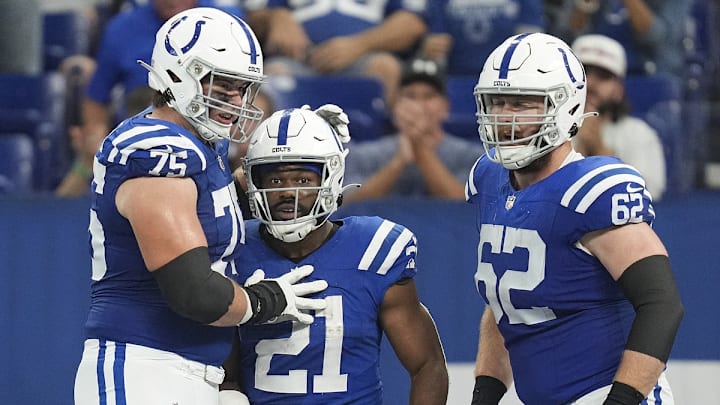 Oct 1, 2023; Indianapolis, Indiana, USA; Indianapolis Colts guard Will Fries (75), running back Zack Moss (21) and center Wesley French (62) celebrate after Moss scored an extra point after a touchdown by tight end Drew Ogletree (85) during the second half of the game against the Los Angeles Rams at Lucas Oil Stadium. 