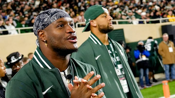 Former Michigan State and current Seattle Seahawks running back Kenneth Walker III takes in the MSU game against Michigan during the first quarter on Saturday, Oct. 25, 2025, at Spartan Stadium in East Lansing. Former Michigan State and current Seattle Seahawks running back Kenneth Walker III takes in the MSU game against Michigan during the first quarter on Saturday, Oct. 25, 2025, at Spartan Stadium in East Lansing.