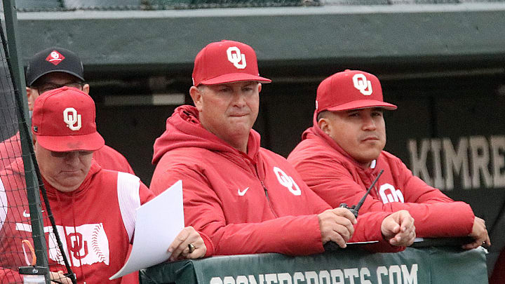 Oklahoma coach Skip Johnson (center)