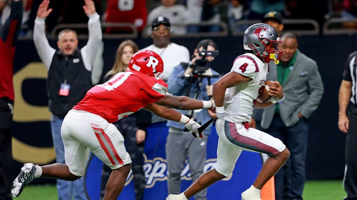 Destrehan quarterback Jai Eugene (4) scores a touchdown against Ruston.