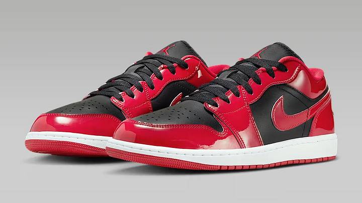 The Air Jordan 1 Low SE 'Patent Varsity Red Black' colorway. The Air Jordan 1 Low SE 'Patent Varsity Red Black' colorway.