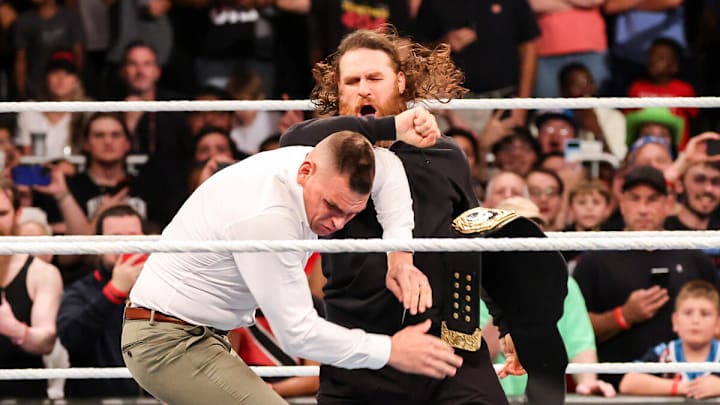 Sami Zayn (top) attacks WWE World Heavyweight Champion Gunther at WWE Bad Blood. Sami Zayn (top) attacks WWE World Heavyweight Champion Gunther at WWE Bad Blood.