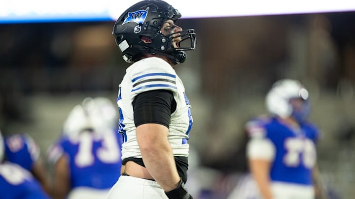 Iowa Western Community College defensive tackle Andy Burburija celebrates during a Reivers contest. 