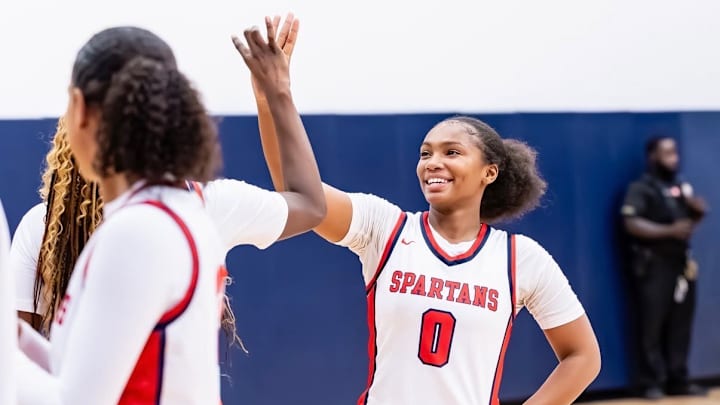 Miami Country Day sophomore guard Arianna Robinson (0) high-fives a teammate during a recent game. The Spartans have won 20 straight games and are ranked No. 2 in this week's High School on SI Top 25 Florida Girls Basketball Rankings. Miami Country Day sophomore guard Arianna Robinson (0) high-fives a teammate during a recent game. The Spartans have won 20 straight games and are ranked No. 2 in this week's High School on SI Top 25 Florida Girls Basketball Rankings.