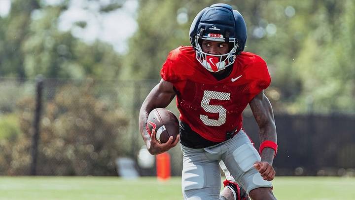 Ole Miss running back Kewan Lacy looks to make a move with the ball in his hands during a fall camp practice (2026). Ole Miss running back Kewan Lacy looks to make a move with the ball in his hands during a fall camp practice (2026).