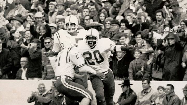 Nebraska punt returner Johnny Rogers (20) celebrates his punt return for a touchdown against Oklahoma in the 1971 'Game of the Century.' Nebraska punt returner Johnny Rogers (20) celebrates his punt return for a touchdown against Oklahoma in the 1971 'Game of the Century.'